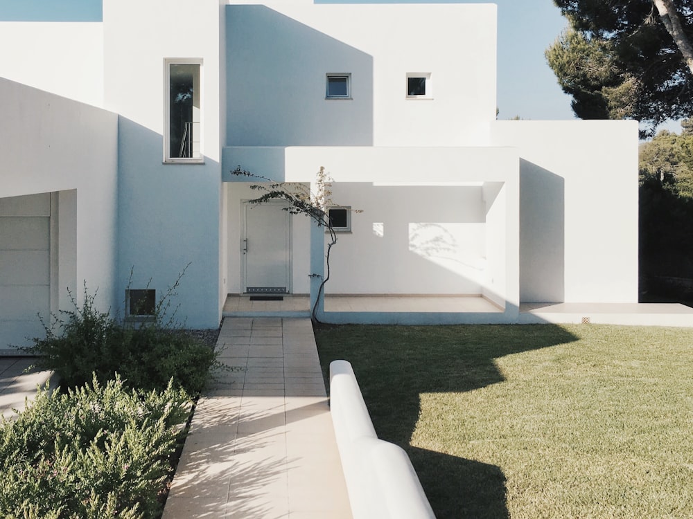 A completed rendered house with landscaped garden